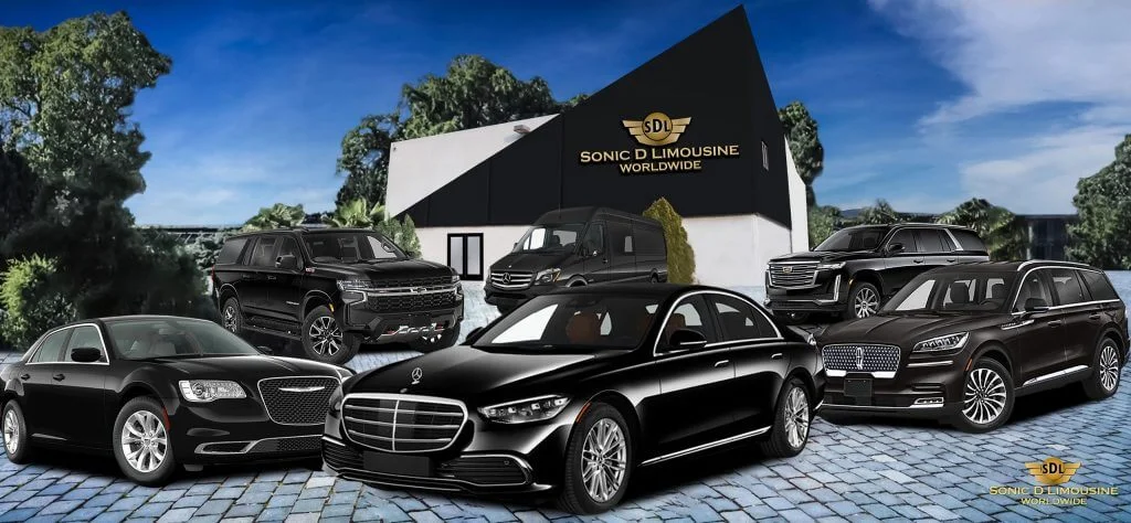 A group of black mercedes benz s class parked in front of a building.