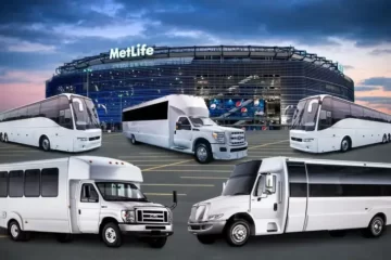 A fleet of white buses providing airport transportation near me parked in front of the NY Giants stadium.