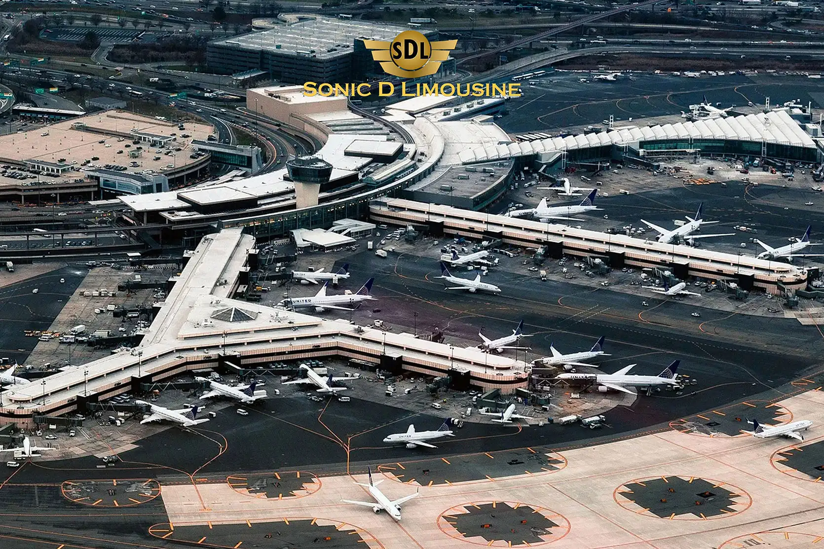 Sonic D Limousine An aerial view of an airport with many planes parked.