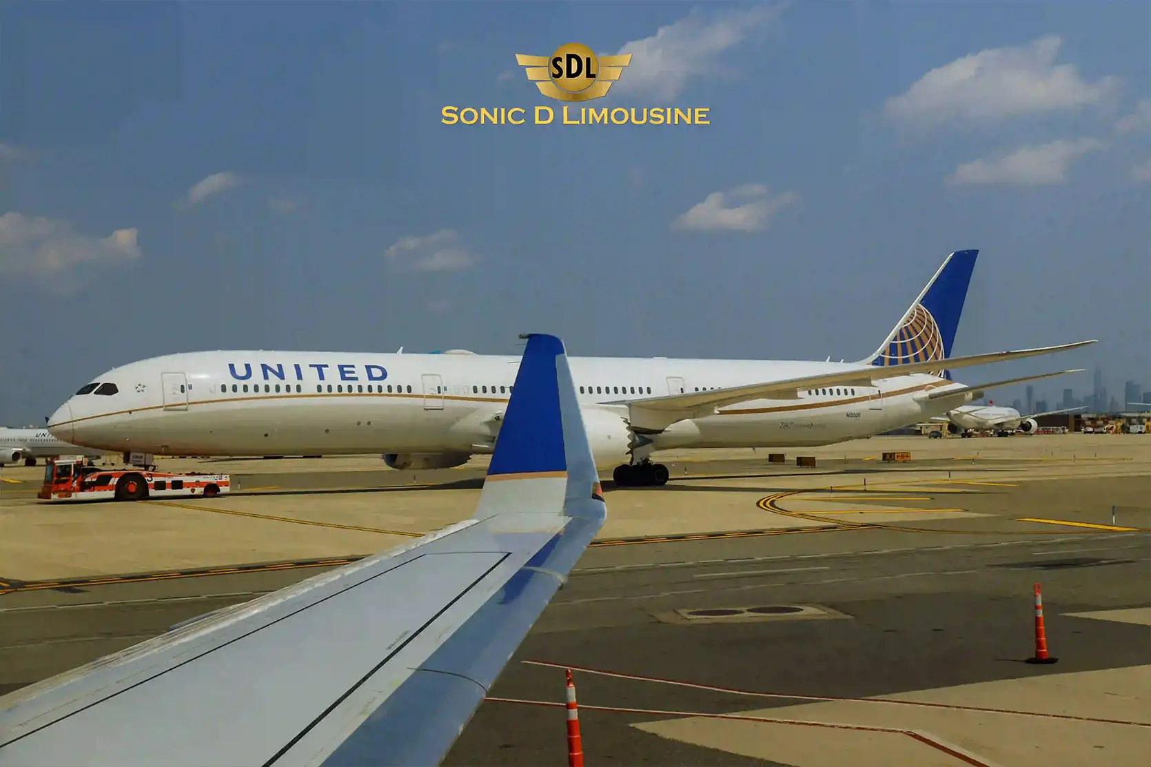 Sonic D Limousine A united airlines airplane parked at an airport.
