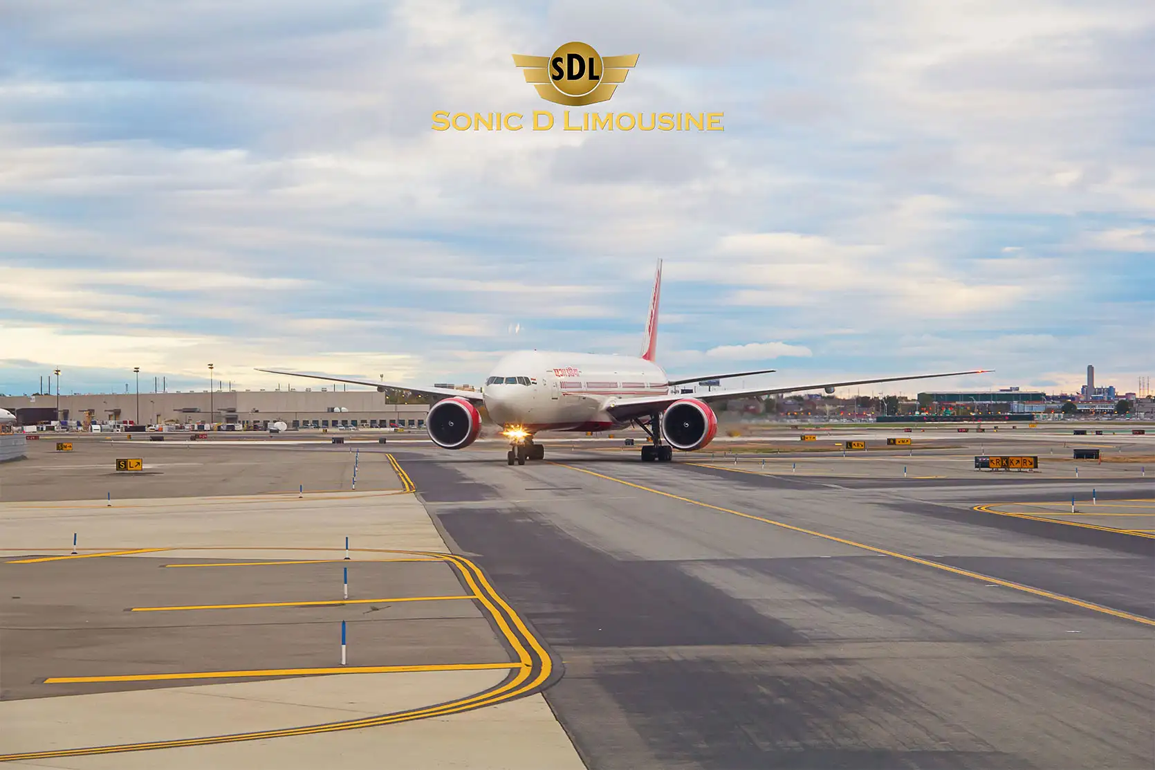 Sonic D Limousine A red and white airplane on a runway.