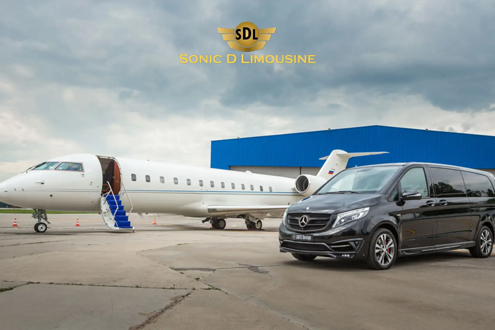 Sonic D Limousine A mercedes benz vito parked next to an airplane.
