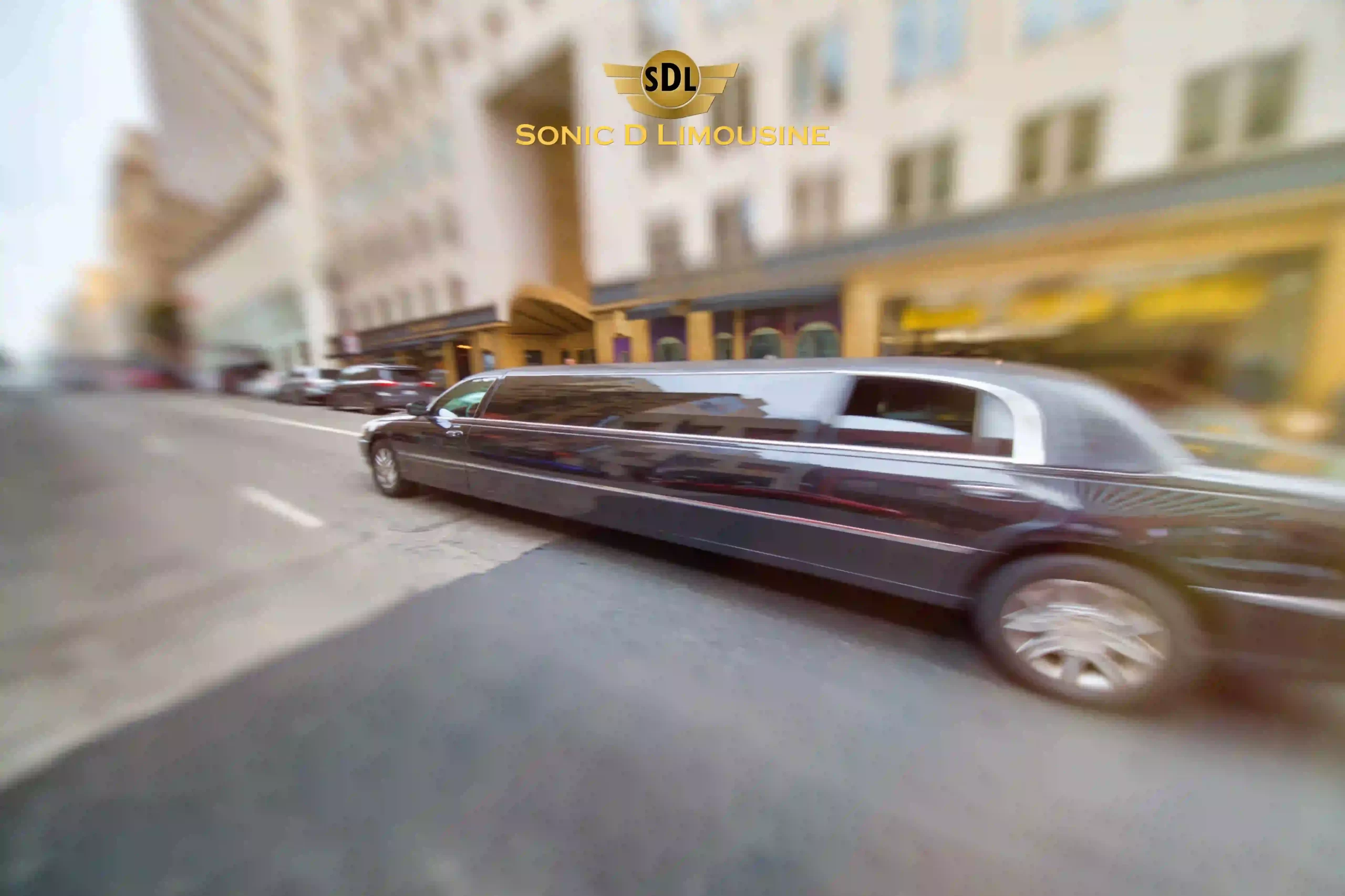 Sonic D Limousine A black limo driving down a city street.